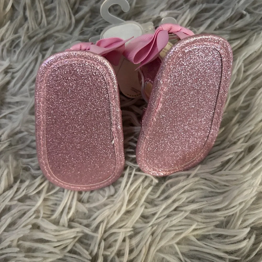 New with tags “First steps” Glittery Pink Kids Sandals. Size 1.
